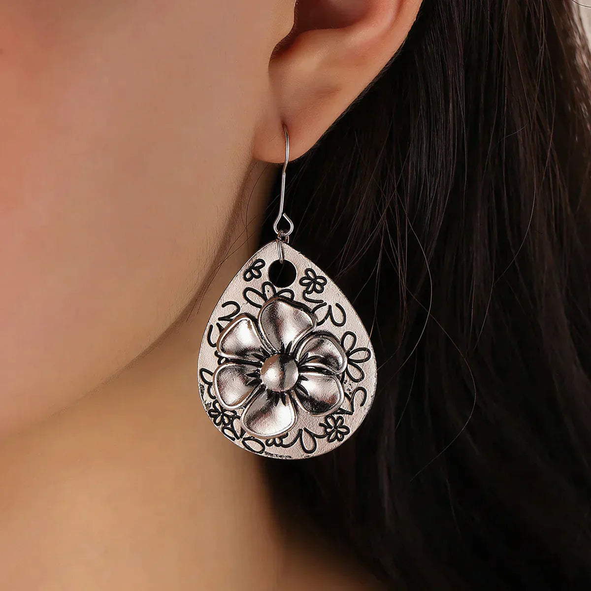 Éblouissantes boucles d'oreilles florales en argent au style boho