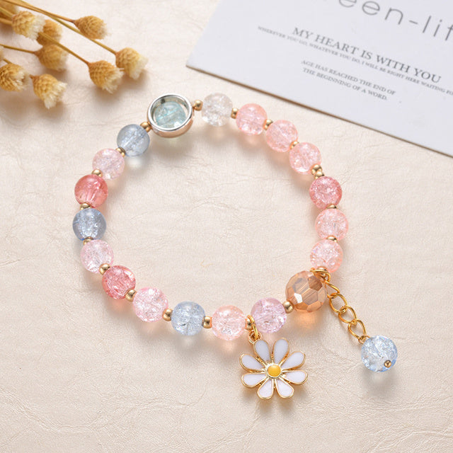 Bracelet Élégant en Pierres Roses et Bleues Agrémenté de Fleurs de Marguerite en Or