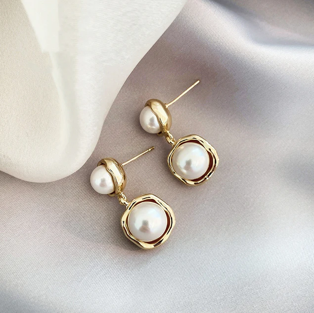 Boucles d'oreilles sophistiquées à double perle pour une touche d'élégance remarquable