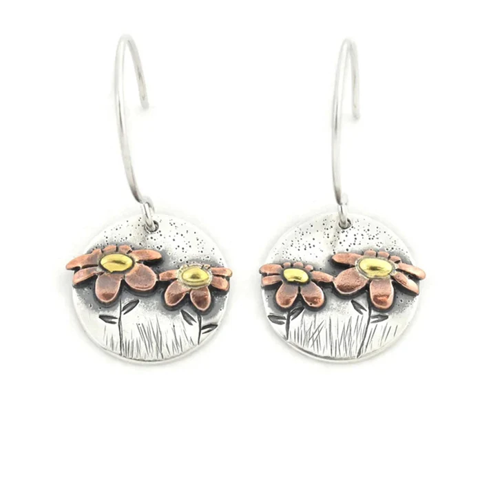 Élégantes boucles d'oreilles vintage en argent aux motifs floraux envoûtants