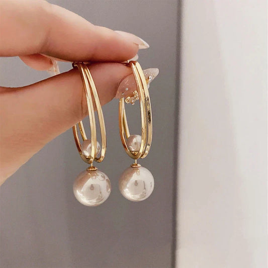 Boucles d'oreilles élégantes en perles dorées au design unique