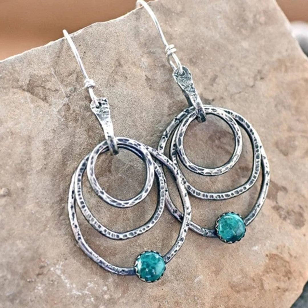 Boucles d'oreilles spirale vintage en argent ornées d'opale éclatante