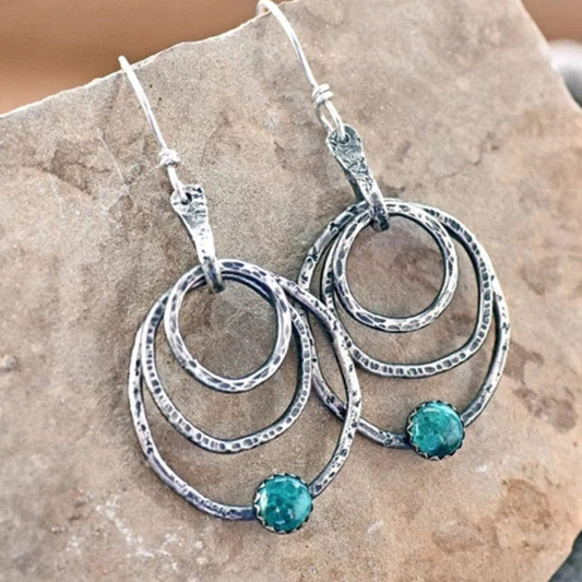 Boucles d'oreilles spirale vintage en argent ornées d'opale éclatante