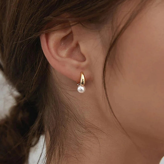 Éclatantes boucles d'oreilles en perles délicates