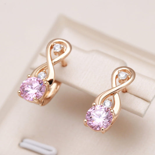 Éblouissantes boucles d'oreilles en cristal rose pour une touche d'élégance.
