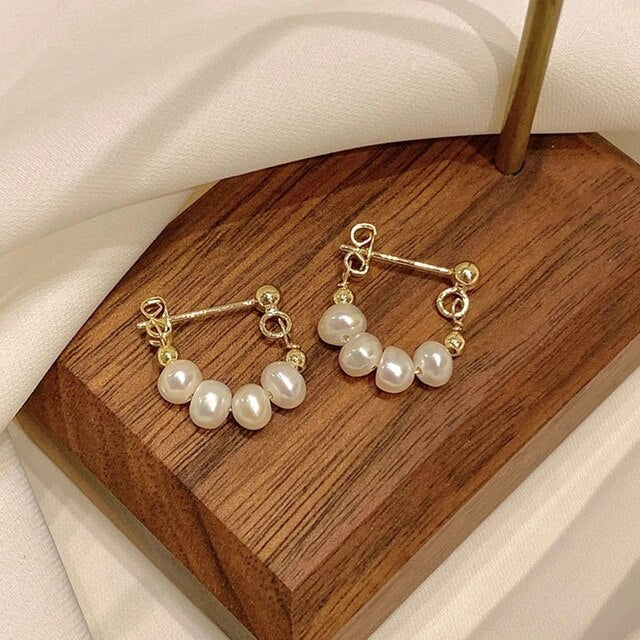 Éblouissantes Boucles d'Oreilles en Perles Dorées