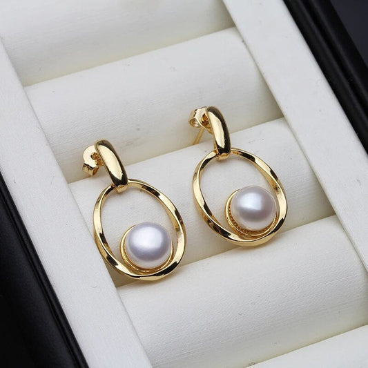 Boucles d'oreilles raffinées en or avec des perles envoûtantes