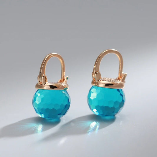 Élégantes boucles d'oreilles sphériques en cristal bleu scintillant