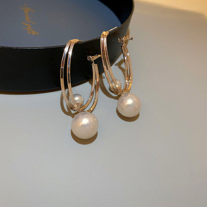 Boucles d'oreilles élégantes en perles dorées au design unique