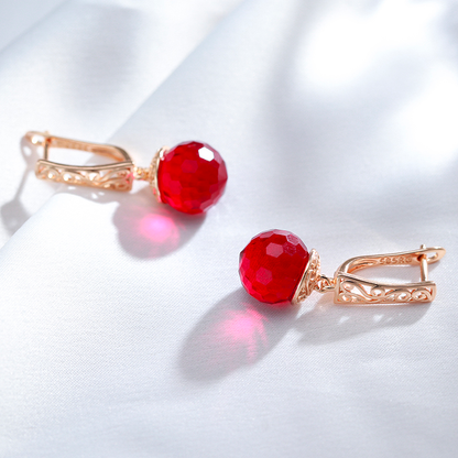 Boucles d'oreilles en Or avec Éblouissantes Boules de Cristal Rouge