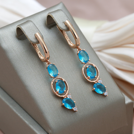 Boucles d'oreilles Élégantes en Or avec Éblouissants Cristaux Bleus