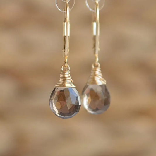 Éclatantes boucles d'oreilles pendantes en cristal doré