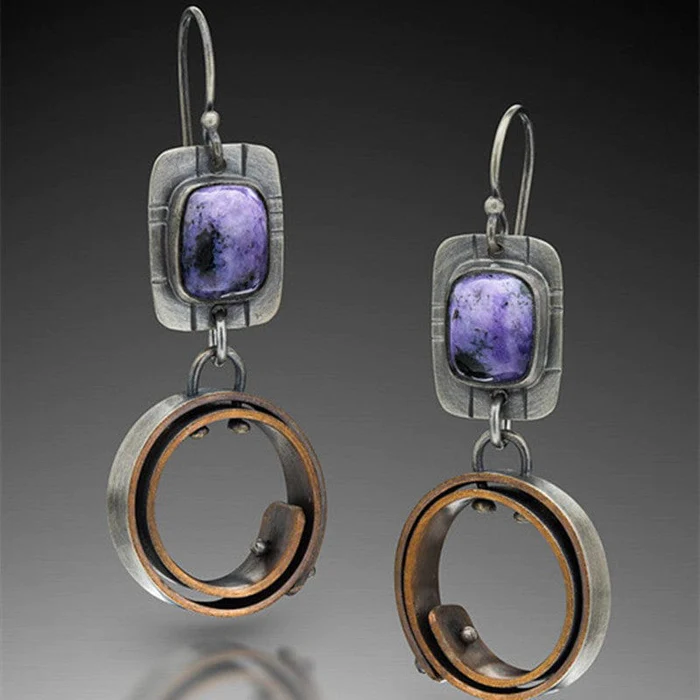 Élégantes boucles d'oreilles vintage en teinte mauve
