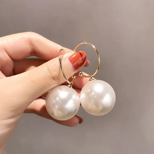 Superbes boucles d'oreilles avec des perles majestueuses