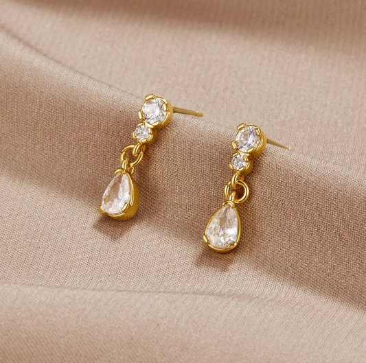 Éblouissantes boucles d'oreilles pendantes en cristal doré