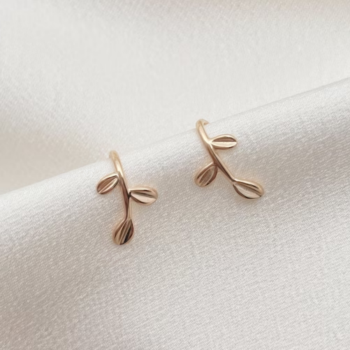 Boucles d'oreilles vintage dorées en forme de feuille élégante