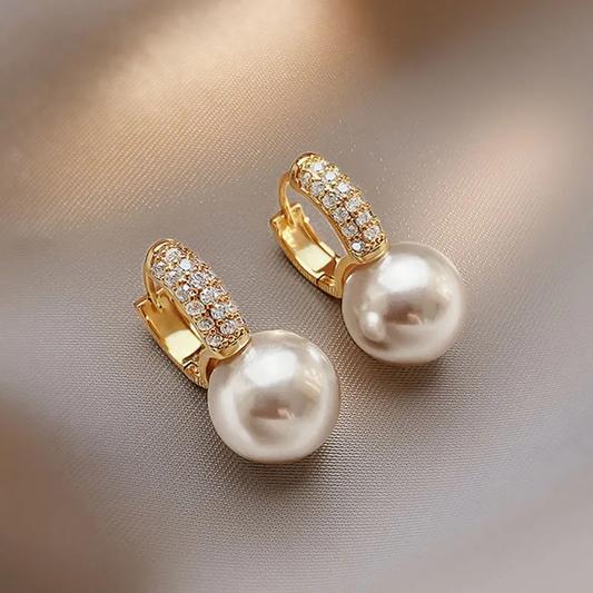Élégantes boucles d'oreilles en perles dorées