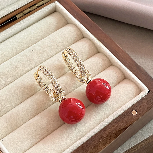Superbes boucles d'oreilles élégantes ornées de perles rouges
