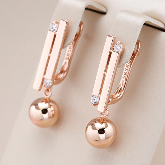 Boucles d'oreilles sophistiquées en sphères dorées étincelantes