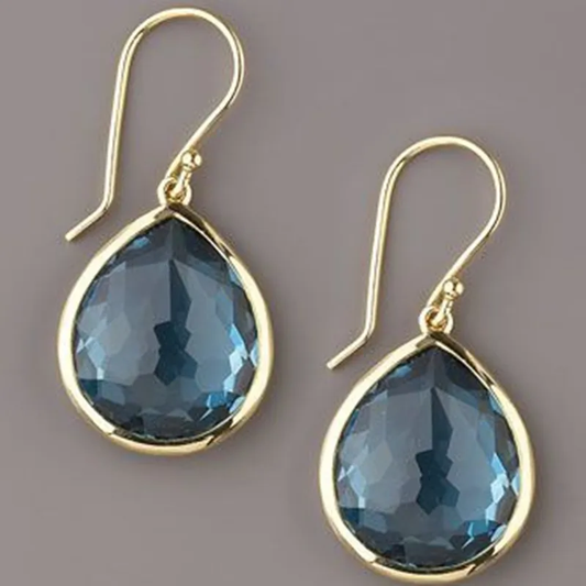 Éblouissantes boucles d'oreilles vintage en cristal bleu