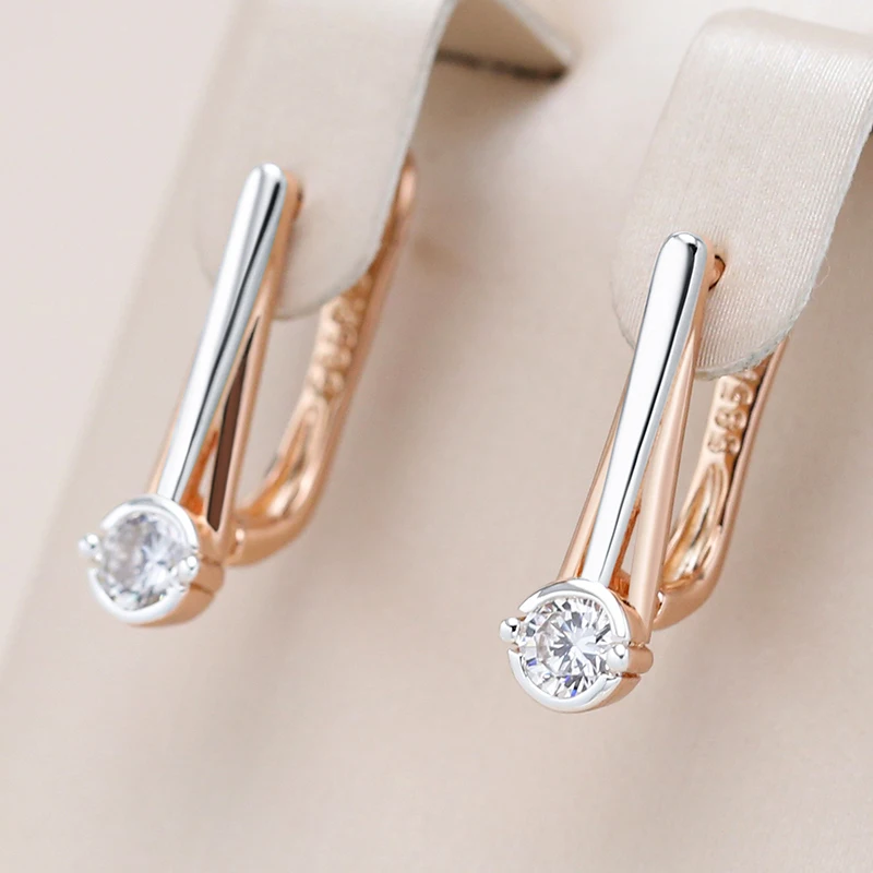 Élégantes boucles d'oreilles en cristal blanc avec finition dorée et argentée