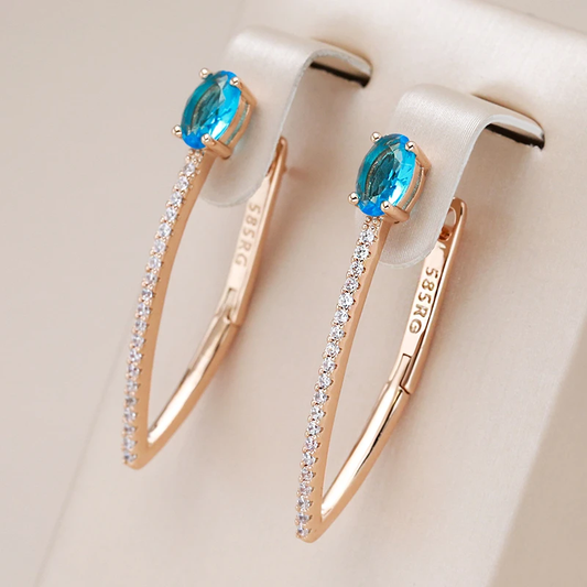 Boucles d'oreilles Élégantes en Or avec Éblouissants Zircons Bleus