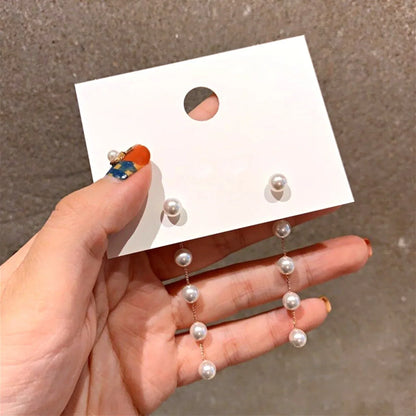 Élégantes Boucles d'Oreilles Pendantes en Or avec Perles Raffinées